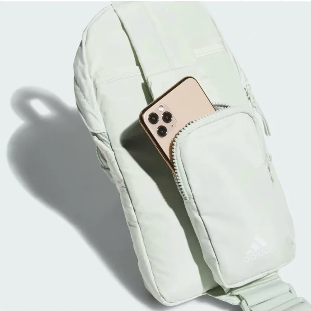 Adidas ESSENTIALS 2-SLING CROSSBODY BAG in Linen Green.  NWT